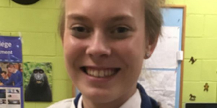 Ana Kriegel smiling in school uniform